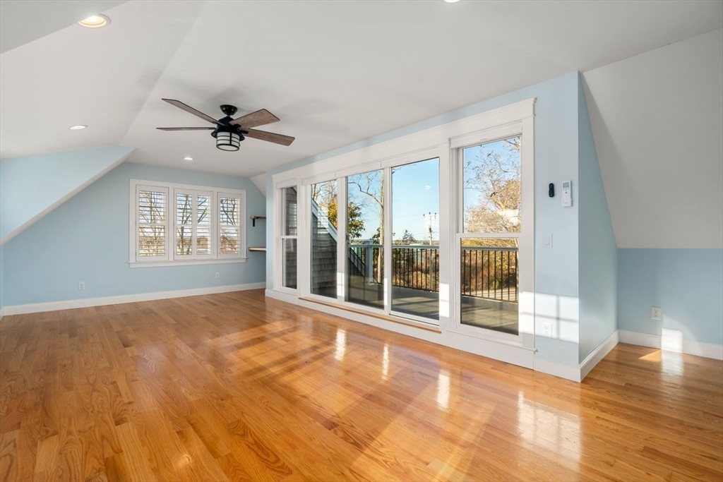 1 Dillingham Avenue Sandwich, MA 02563 - Photo 19 of 36 a view of an empty room with a window and wooden floor