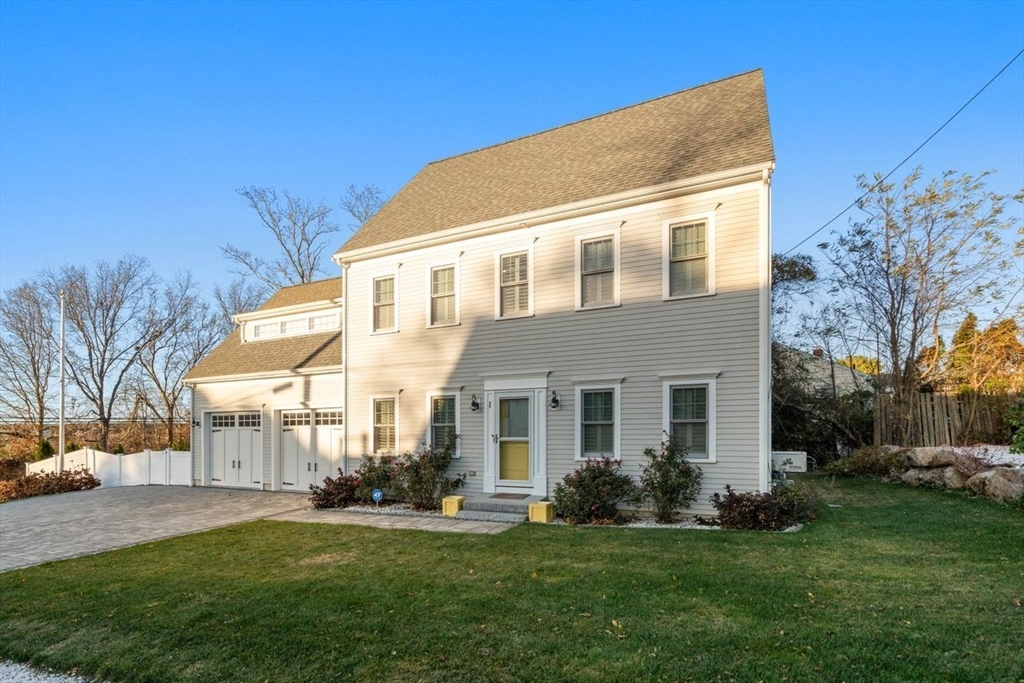 1 Dillingham Avenue Sandwich, MA 02563 - Photo 27 of 36 a front view of a house with a yard