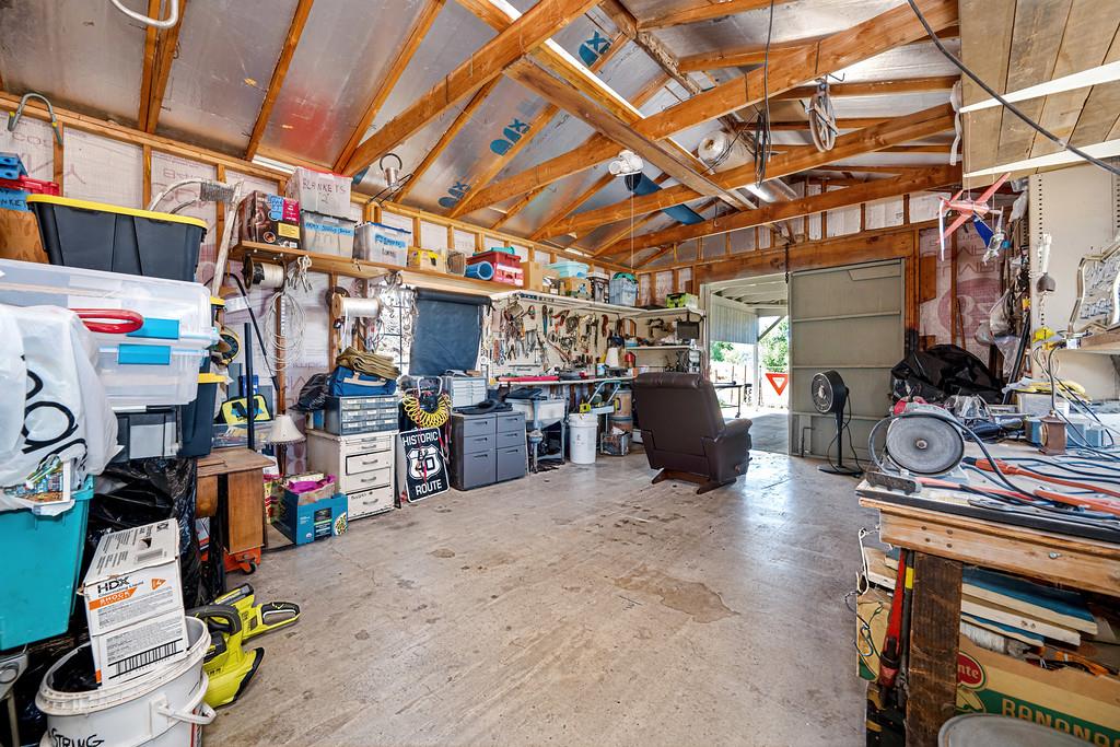 7630 Ridge Road Newcastle, CA 95658 - Photo 76 of 85 Inside of workshop with attached expansive paved carport, perfect to work on cars or projects - a "Man Cave Delight!"