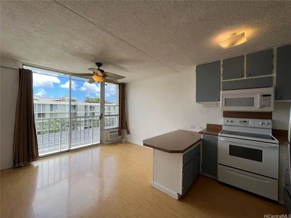 a kitchen with a stove and a microwave