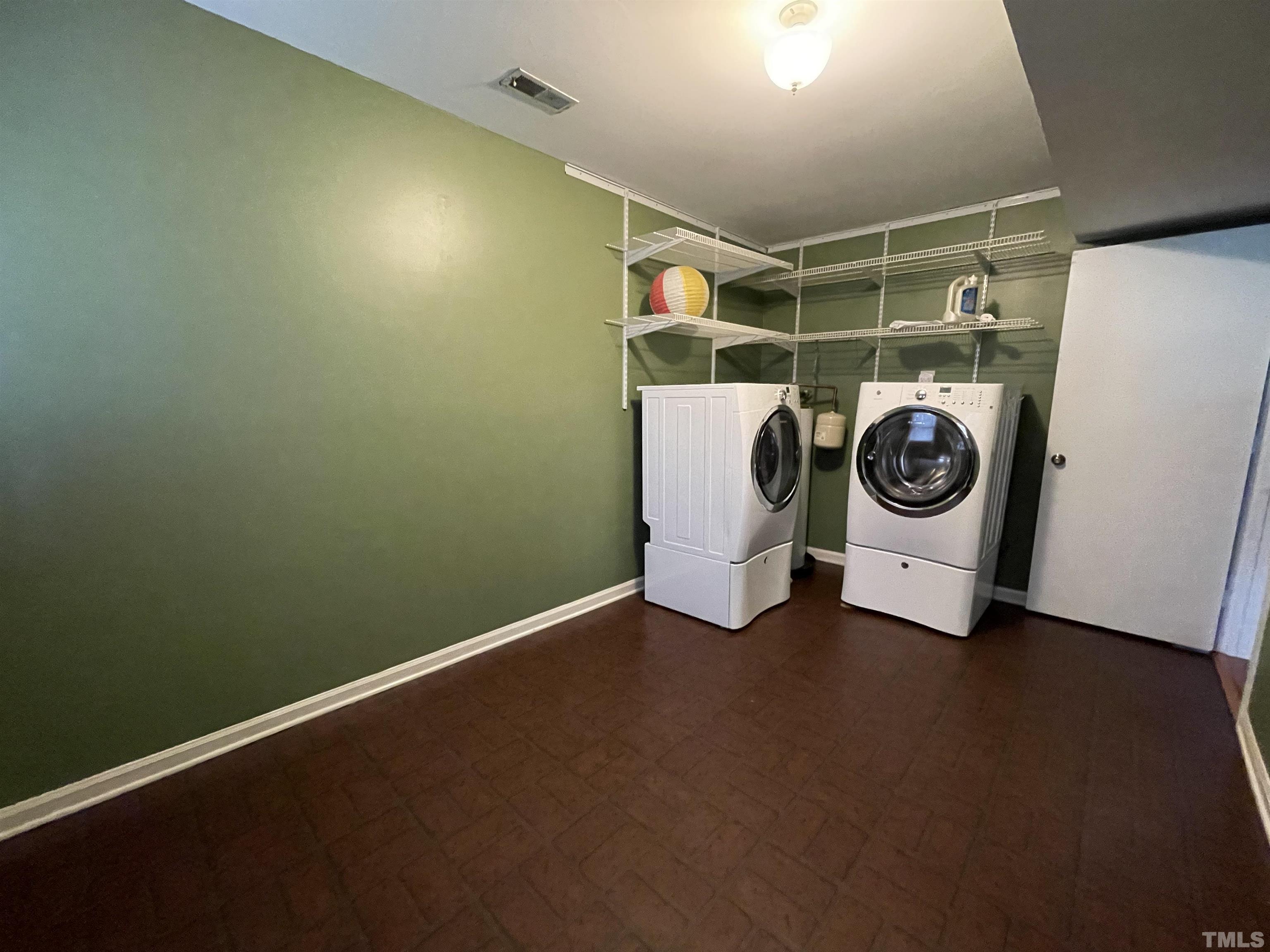501 Sawmill Road Raleigh, NC 27615 - Photo 22 of 31 a utility room with dryer and washer