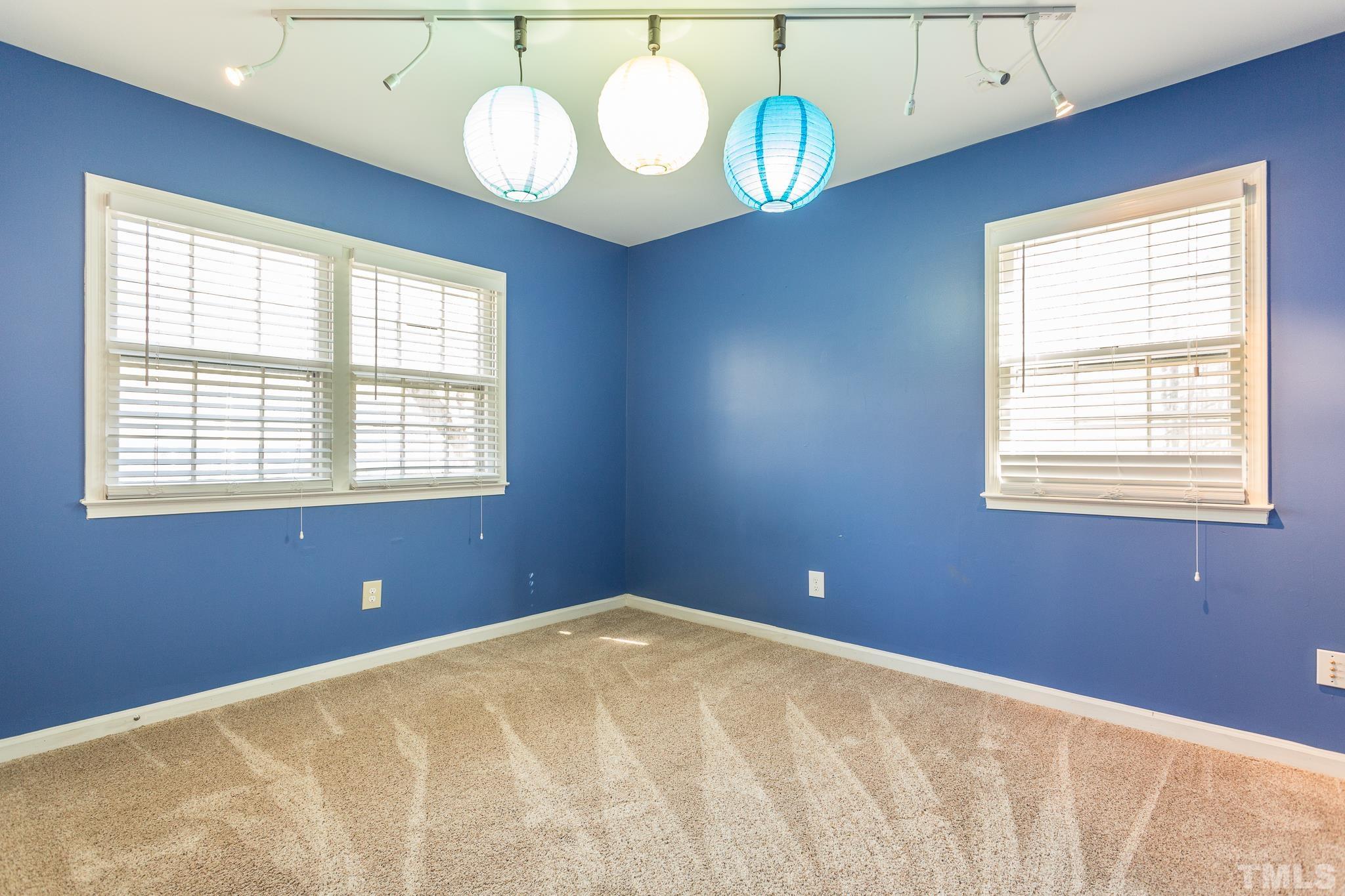 501 Sawmill Road Raleigh, NC 27615 - Photo 23 of 31 a bedroom with a bed and window