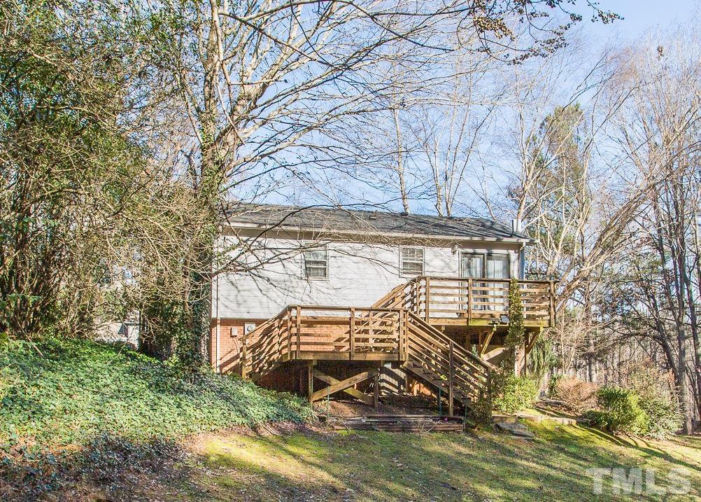 501 Sawmill Road Raleigh, NC 27615 - Photo 30 of 31 a view of a wooden deck and a yard