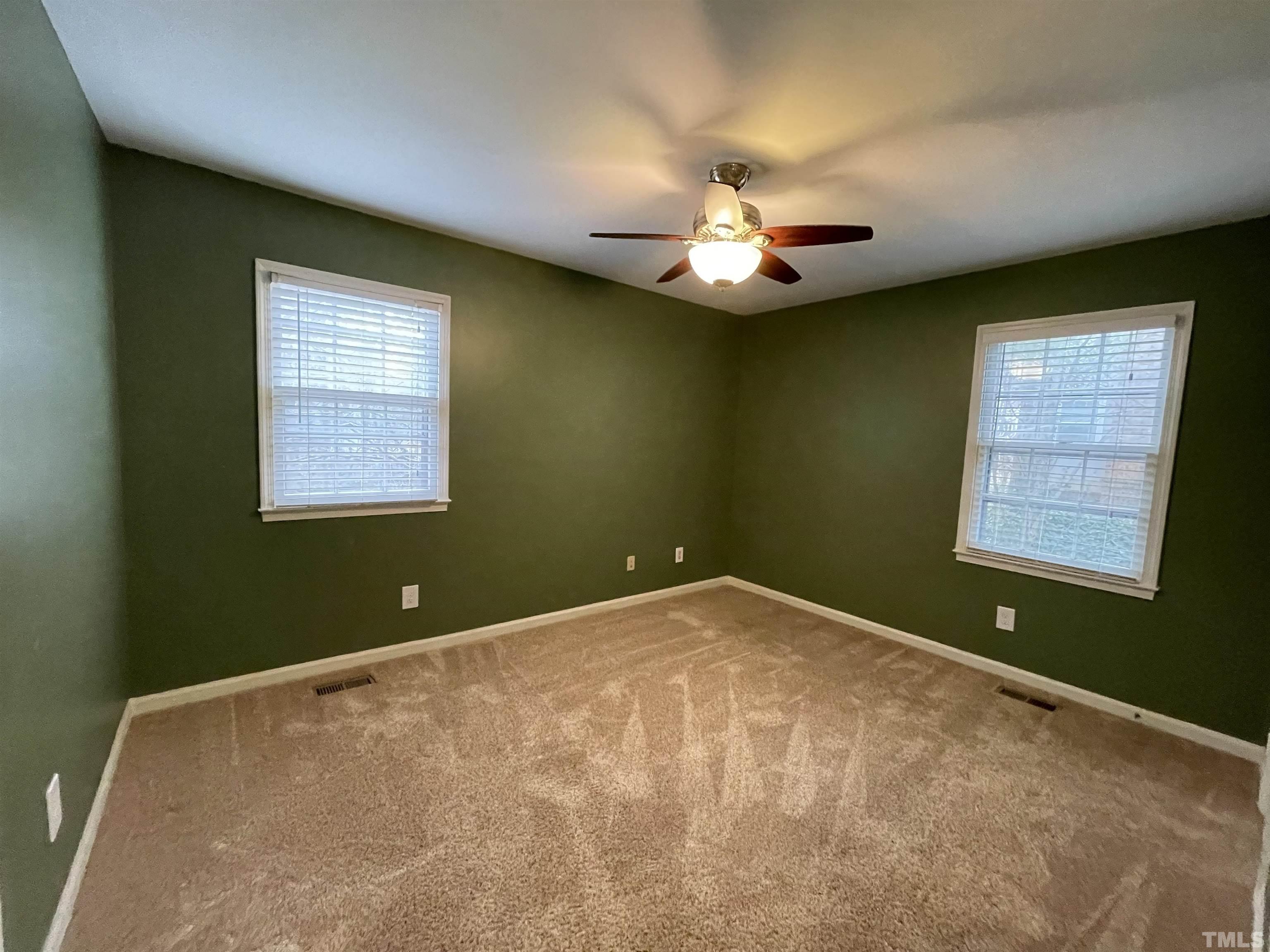 501 Sawmill Road Raleigh, NC 27615 - Photo 8 of 31 a view of a room with a ceiling fan and a window