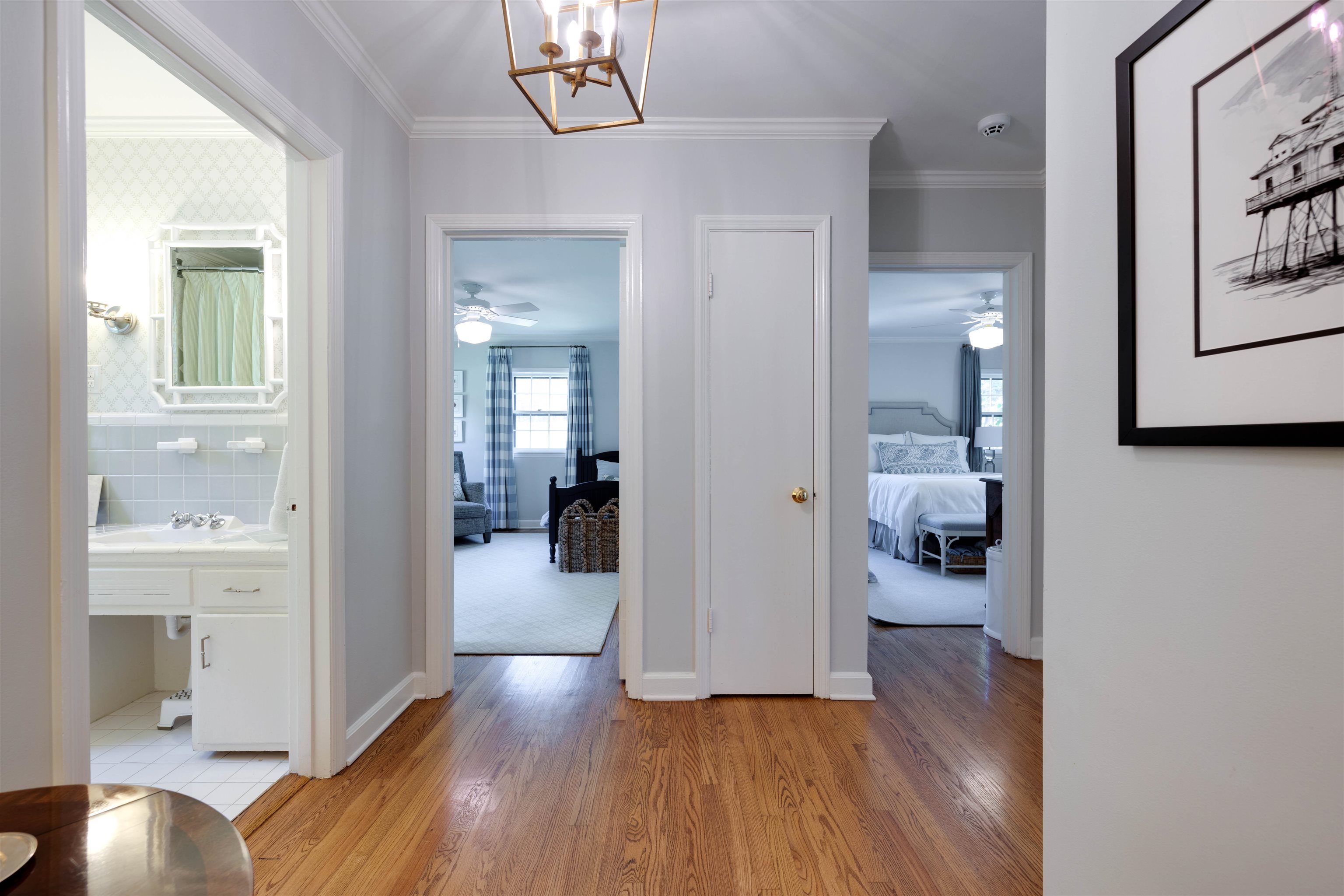 5430 Normandy Road Memphis, TN 38120 - Photo 20 of 32 A wide back hall creates nice separation between the bedrooms. Bedroom 2 with ensuite is the door on the right, Bedroom 3 to the left shares the hall bath with Bedroom 4.