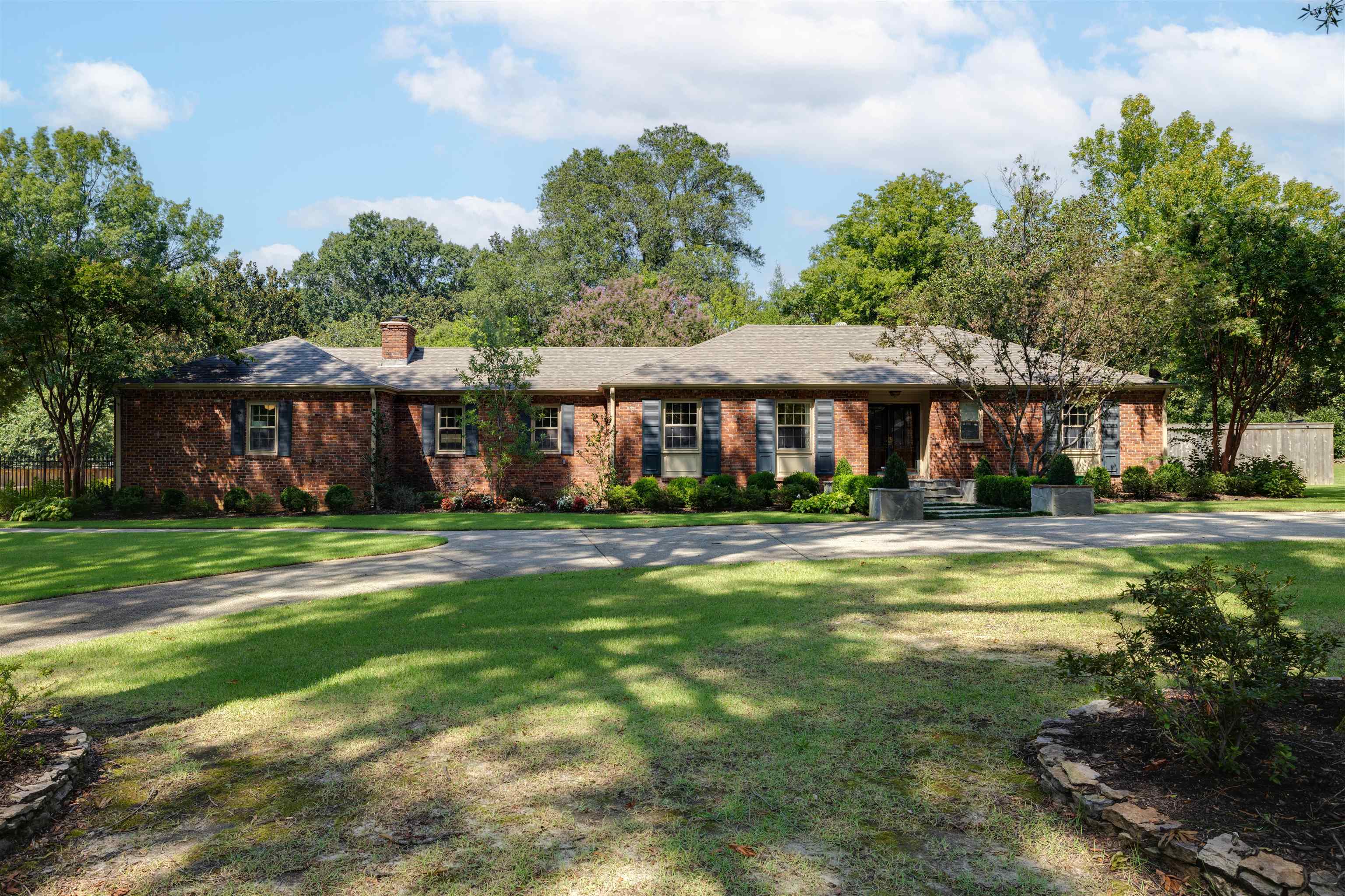 5430 Normandy Road Memphis, TN 38120 - Photo 2 of 32 The large lot with mature landscaping offers privacy while the new circular driveway provides convenience when entertaining friends and family.