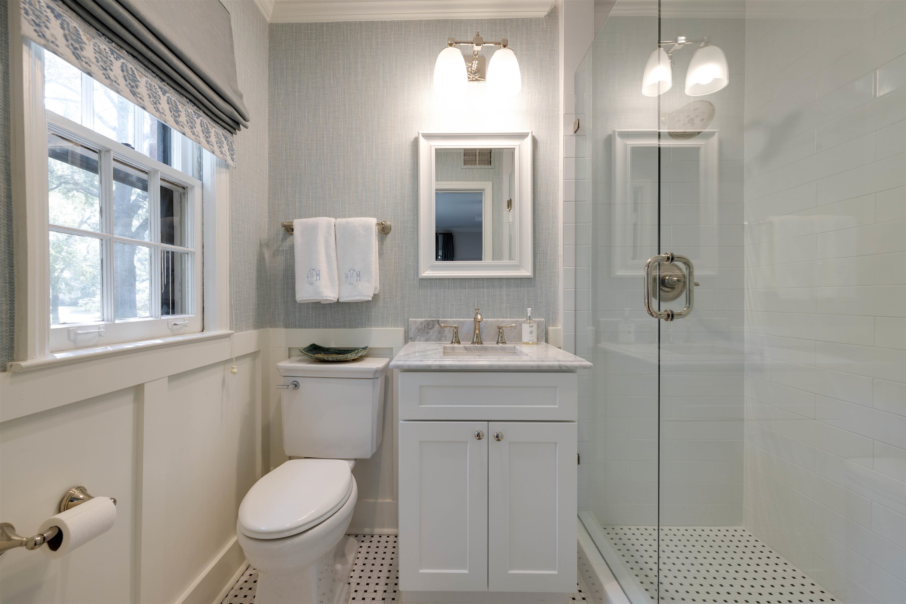 5430 Normandy Road Memphis, TN 38120 - Photo 22 of 32 Note the tile floor, wainscotting, and carrera marble countertop.