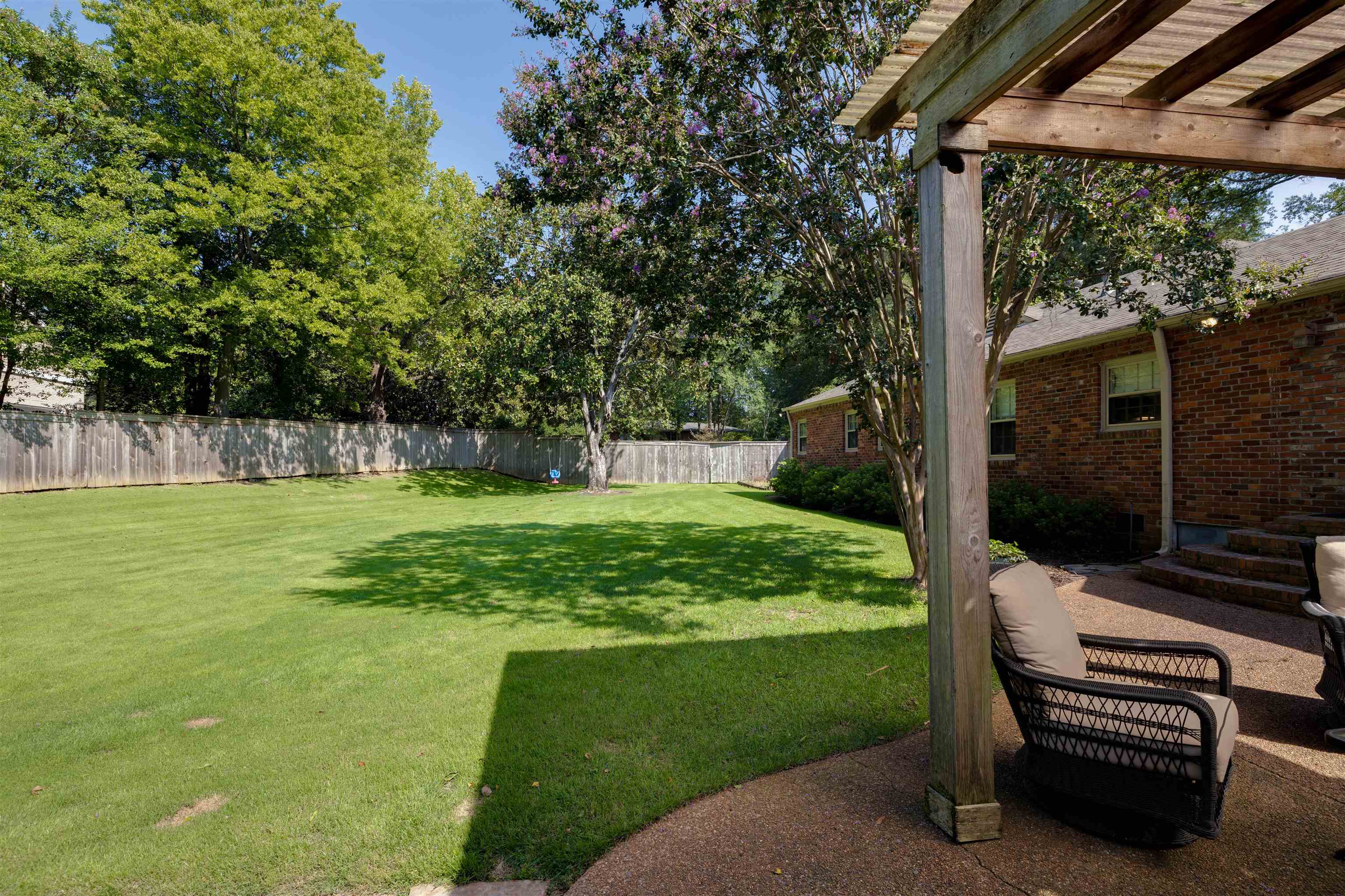 5430 Normandy Road Memphis, TN 38120 - Photo 28 of 32 Extensive editing of the yard, removal of brush trees along the back fenceline. Sprinkler system installed covers entire yard.