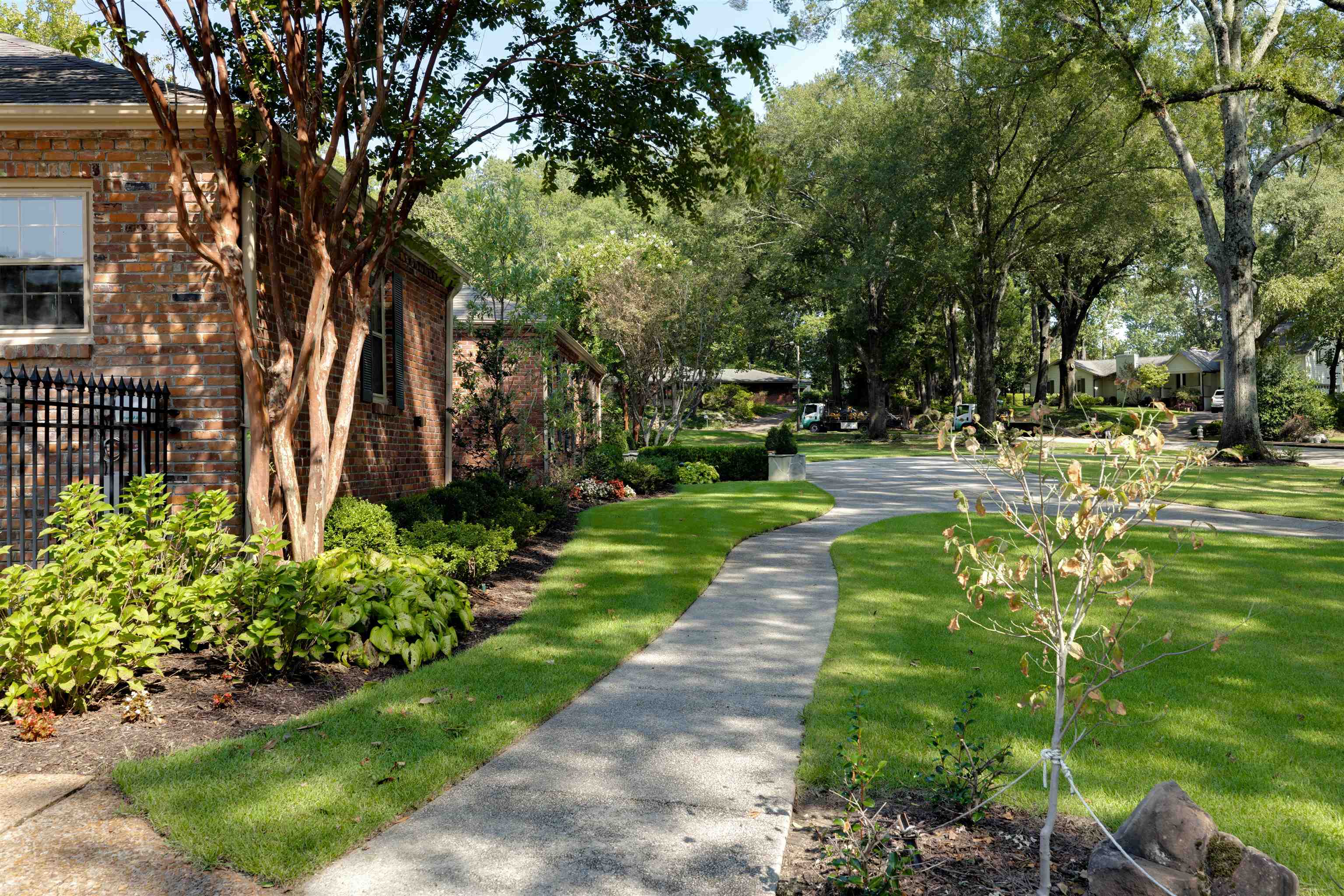 5430 Normandy Road Memphis, TN 38120 - Photo 30 of 32 This walkway connects the driveway to the garage and the new circular driveway in front of the house.
