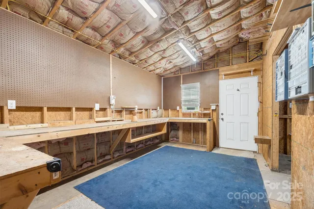 a large white kitchen with a large window