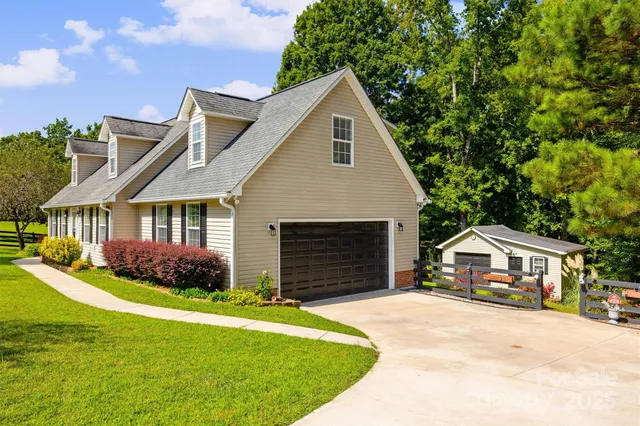 a front view of house with yard and green space