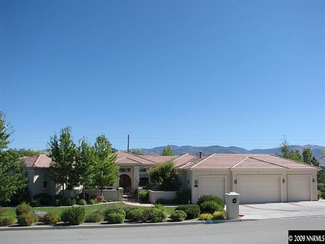 12680 Silver Wolf Road Reno, NV 89511 - Photo 1 of 9 a front view of a house with a yard and garage