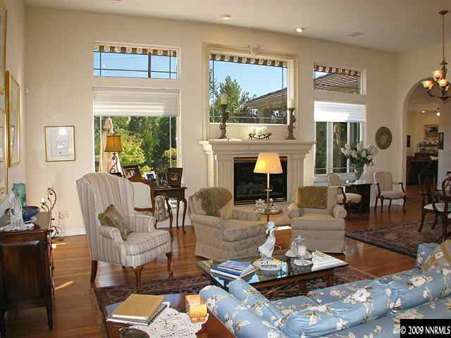 12680 Silver Wolf Road Reno, NV 89511 - Photo 3 of 9 a living room with fireplace furniture and a large window