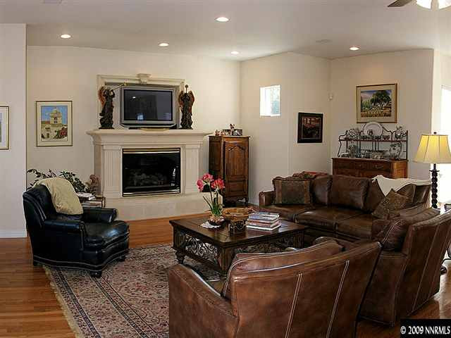 12680 Silver Wolf Road Reno, NV 89511 - Photo 6 of 9 a living room with furniture and a fireplace