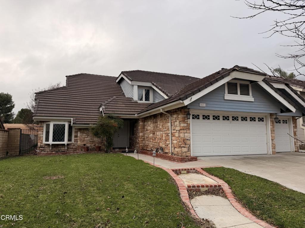 2621 Bitternut Circle Simi Valley, CA 93065 - Photo 2 of 20 a front view of a house with garden