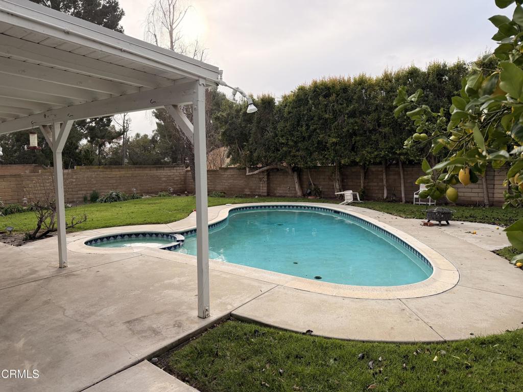 2621 Bitternut Circle Simi Valley, CA 93065 - Photo 3 of 20 a view of a swimming pool with a yard