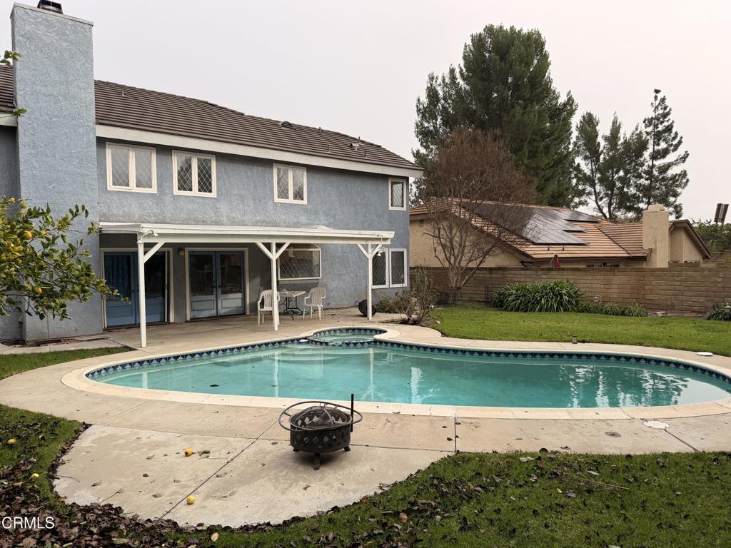 2621 Bitternut Circle Simi Valley, CA 93065 - Photo 4 of 20 a white house with a large pool in front of it