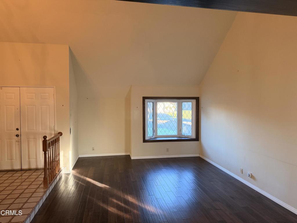 2621 Bitternut Circle Simi Valley, CA 93065 - Photo 5 of 20 an empty room with wooden floor and windows