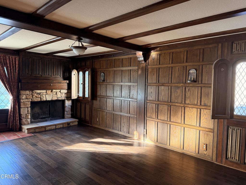 2621 Bitternut Circle Simi Valley, CA 93065 - Photo 8 of 20 a view of empty room with wooden floor and fireplace