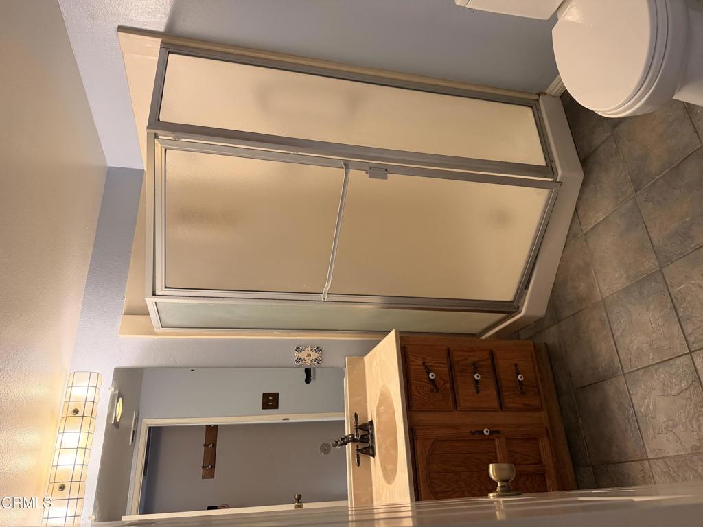 2621 Bitternut Circle Simi Valley, CA 93065 - Photo 10 of 20 a bathroom with a mirror and a window