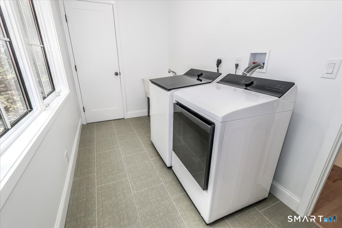 256 Wilton Road East Ridgefield, CT 06877 - Photo 22 of 40 a utility room with dryer and washer
