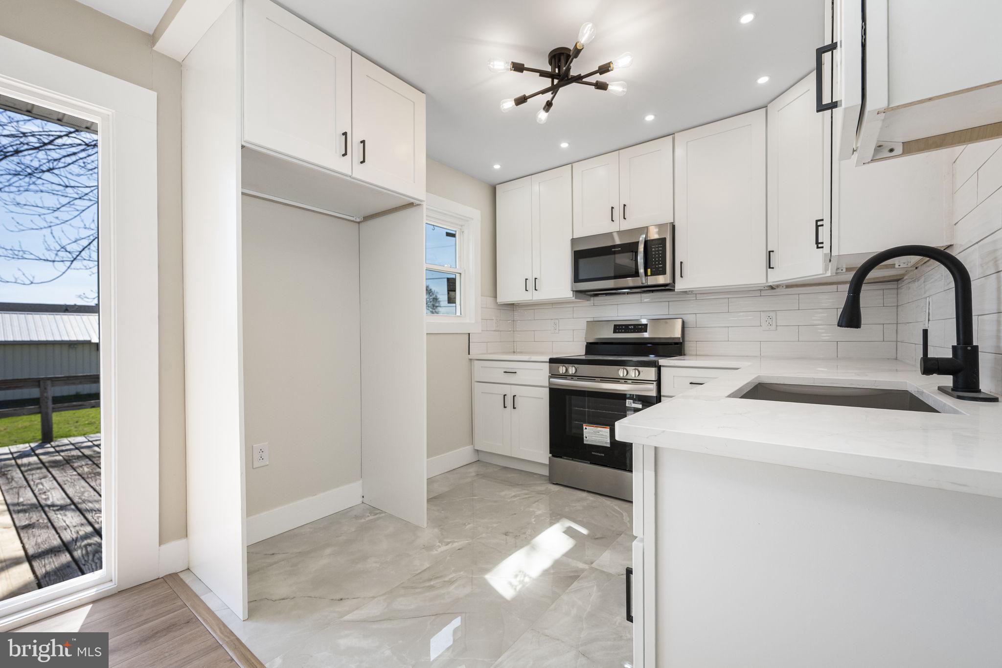 319 Fairview Chapel Road Birdsboro, PA 19508 - Photo 8 of 34 Modern kitchen with sleek finishes.