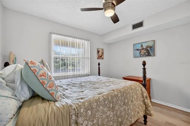 a bedroom with bed and a window