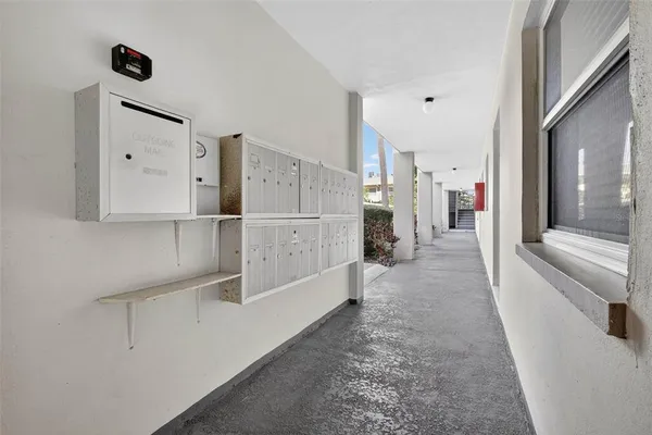a view of kitchen with furniture and refrigerator