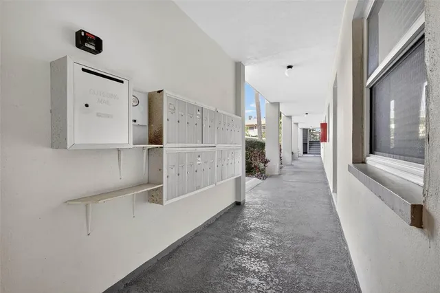 a view of kitchen with furniture and refrigerator