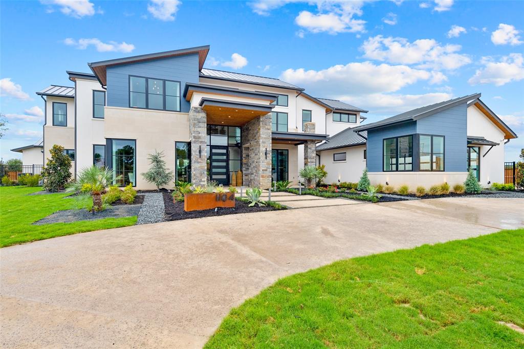 a view of a house with a swimming pool and a yard