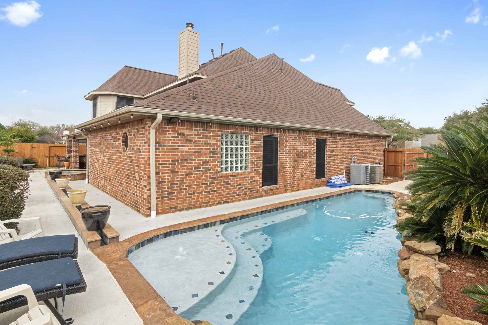 4311 Green Tree Court Pasadena, TX 77505 - Photo 43 of 49 Custom waterway from hot tub to the pool.