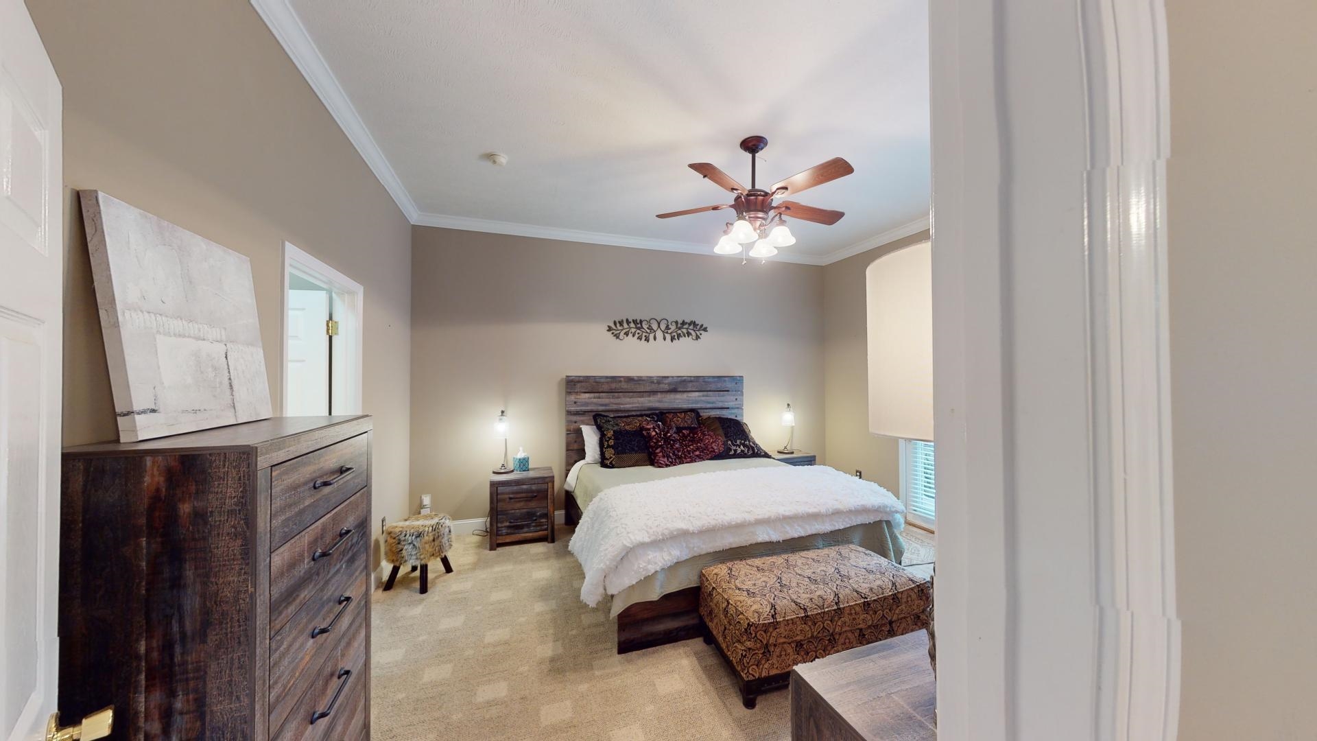 19 Aqua Drive Iuka, MS 38852 - Photo 12 of 33 a bedroom with a bed and a chandelier