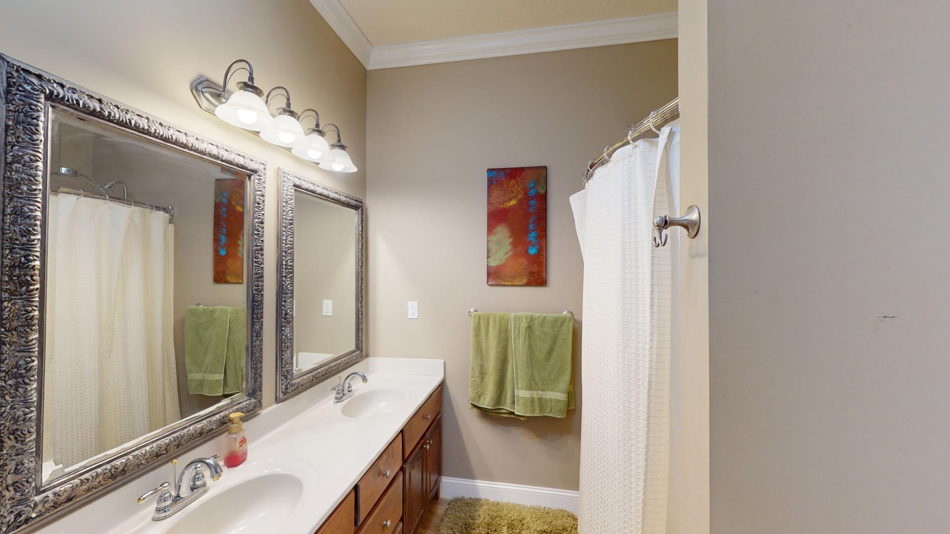 19 Aqua Drive Iuka, MS 38852 - Photo 14 of 33 a en suite bathroom with a sink double vanity and mirror
