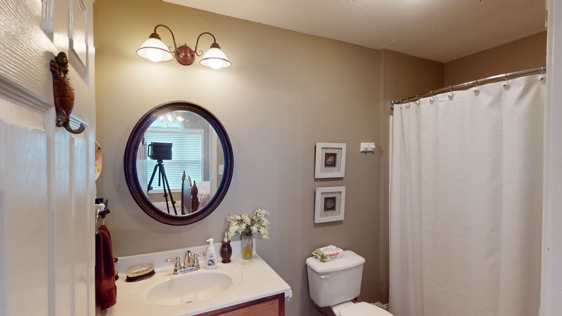 19 Aqua Drive Iuka, MS 38852 - Photo 16 of 33 a bathroom with a sink a toilet and a mirror