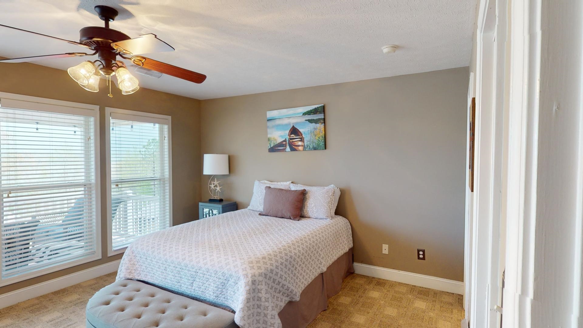 19 Aqua Drive Iuka, MS 38852 - Photo 17 of 33 a bedroom with a bed and a chandelier