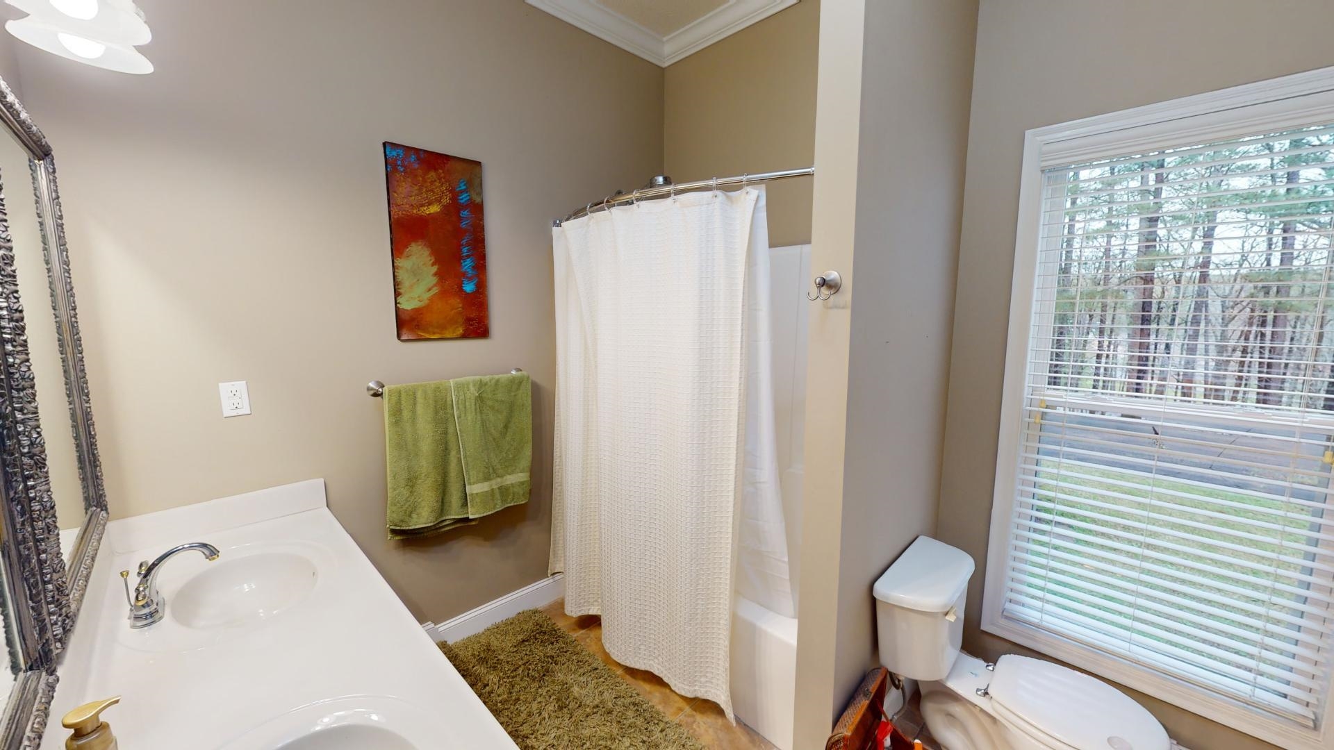 19 Aqua Drive Iuka, MS 38852 - Photo 21 of 33 a bathroom with a toilet and a sink