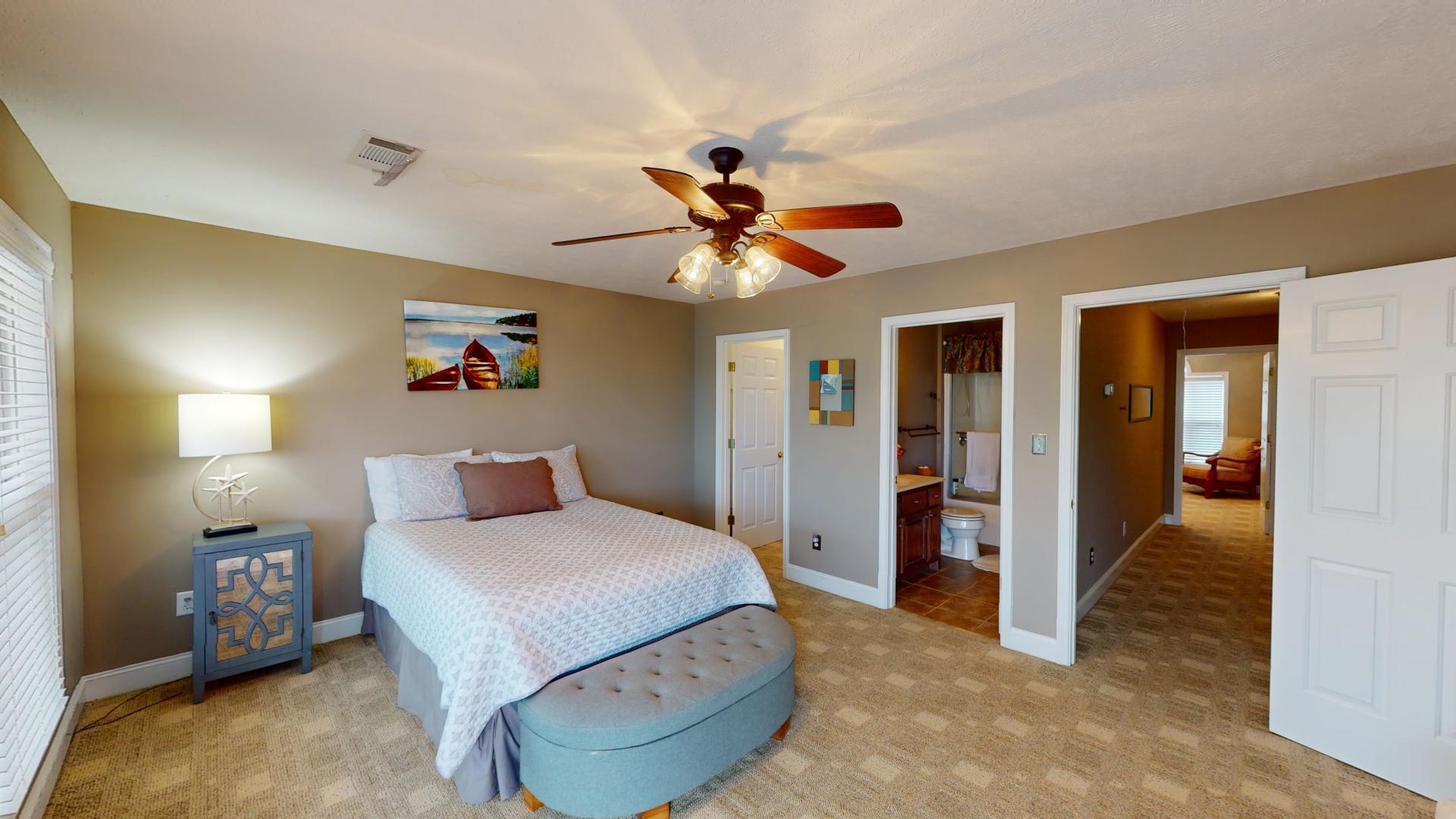 19 Aqua Drive Iuka, MS 38852 - Photo 23 of 33 a bedroom with a bed and a chandelier