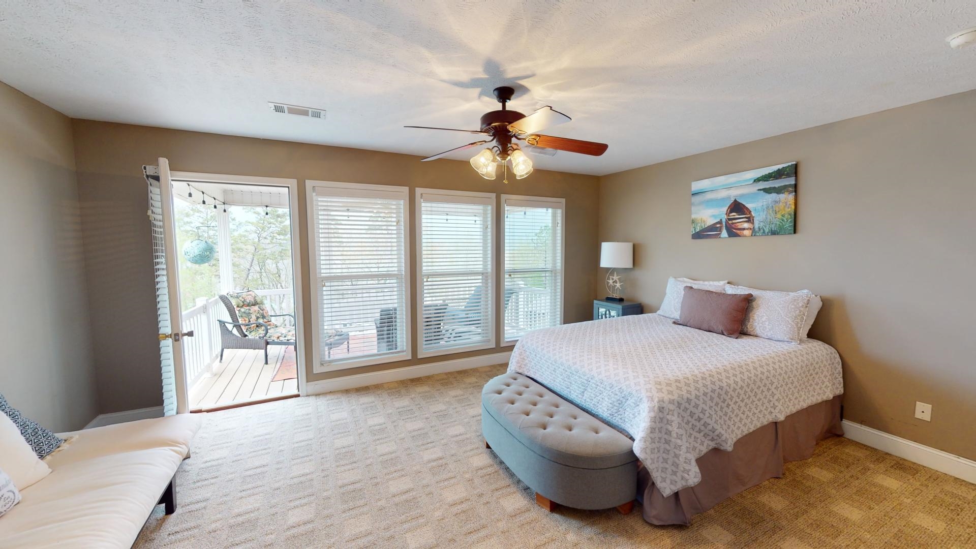 19 Aqua Drive Iuka, MS 38852 - Photo 24 of 33 a spacious bedroom with a large bed and a large window