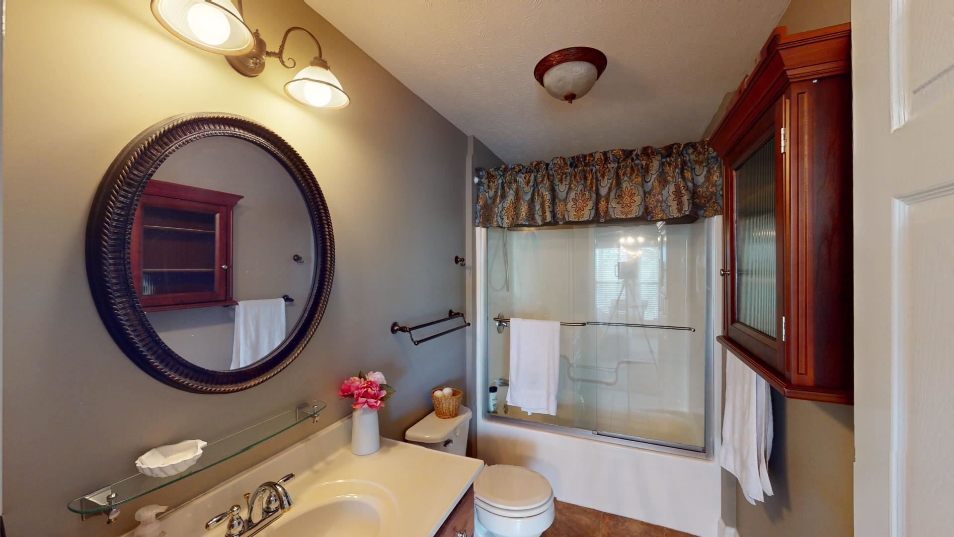 19 Aqua Drive Iuka, MS 38852 - Photo 30 of 33 a bathroom with a sink mirror and toilet