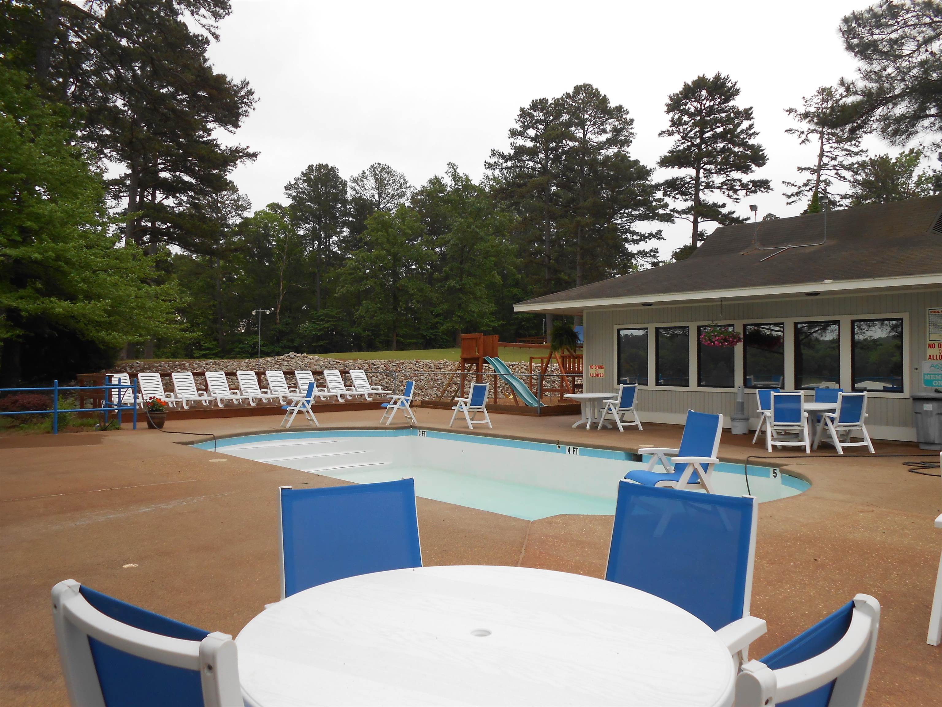 19 Aqua Drive Iuka, MS 38852 - Photo 32 of 33 a swimming pool with outdoor seating and outdoor seating