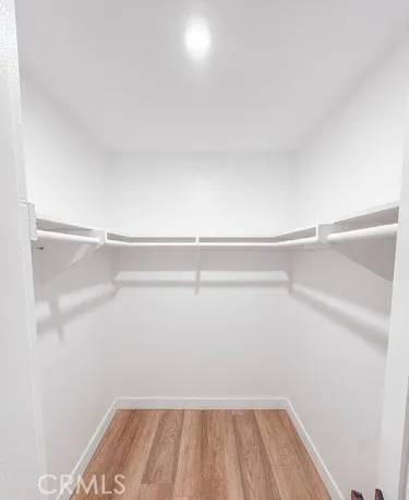 a kitchen with kitchen island a stove a refrigerator and a sink