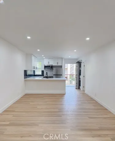 a view of kitchen and kitchen with furniture