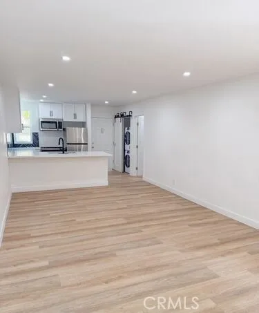 a bathroom with a toilet sink a mirror and vanity