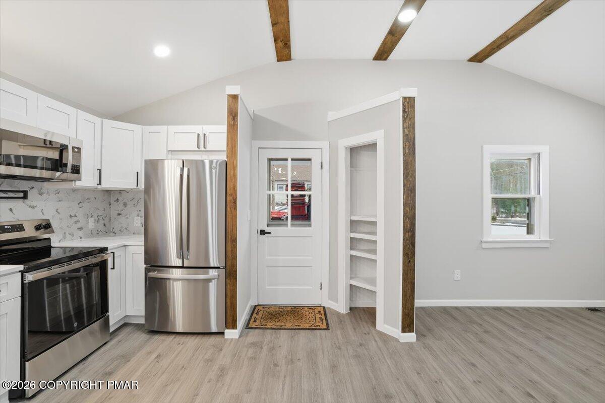 481 Wooddale Road East Stroudsburg, PA 18302 - Photo 11 of 37 a kitchen with stainless steel appliances a refrigerator and a stove top oven