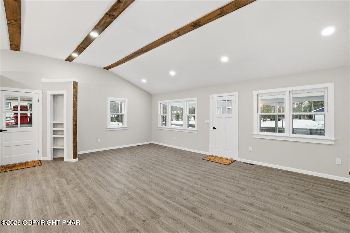 481 Wooddale Road East Stroudsburg, PA 18302 - Photo 12 of 37 a view of an empty room with wooden floor and a window