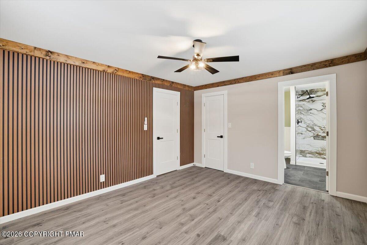 481 Wooddale Road East Stroudsburg, PA 18302 - Photo 16 of 37 a view of a big room with wooden floor and closet area
