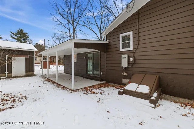 a view of a dinning table and chairs in the patio