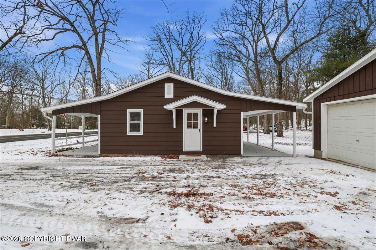481 Wooddale Road East Stroudsburg, PA 18302 - Photo 6 of 37 a front view of a house with a yard