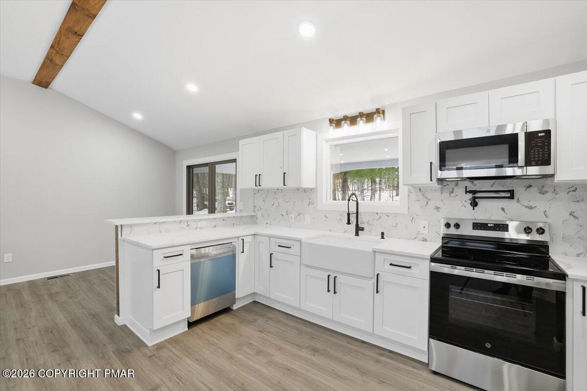 481 Wooddale Road East Stroudsburg, PA 18302 - Photo 8 of 37 a kitchen with a sink stove and microwave