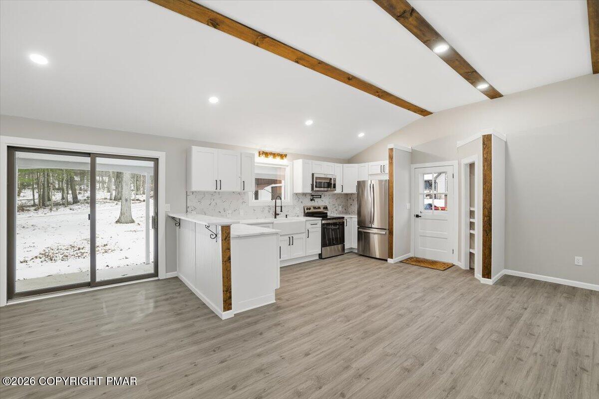 481 Wooddale Road East Stroudsburg, PA 18302 - Photo 10 of 37 a view of a kitchen with furniture and wooden floor